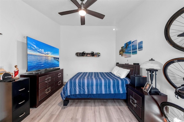 bedroom with ceiling fan and light wood-type flooring