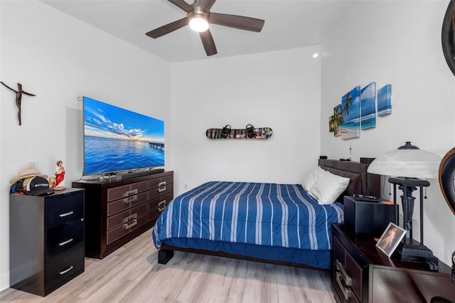 bedroom with light hardwood / wood-style flooring and ceiling fan