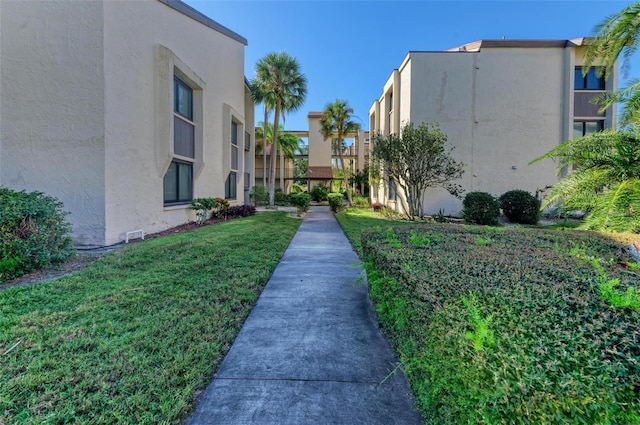 view of community featuring a yard