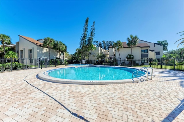 view of swimming pool with a patio