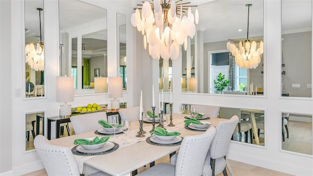 dining room with a notable chandelier, light wood-type flooring, and ornamental molding