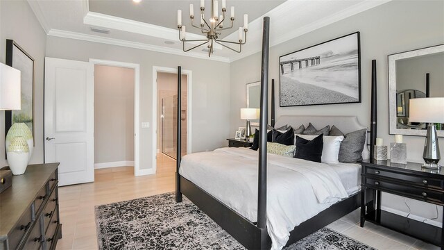 bedroom with a raised ceiling, crown molding, and an inviting chandelier