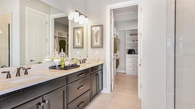 bathroom featuring tile patterned floors, vanity, and an enclosed shower