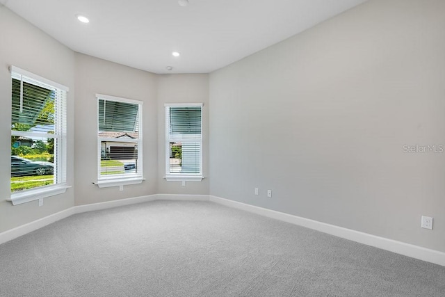 10442 Morning Mist, Sarasota, FL 34241 - carpeted spare room with baseboards and recessed lighting