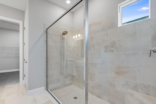 10442 Morning Mist, Sarasota, FL 34241 - full bath featuring a shower stall, a spacious closet, baseboards, and tile patterned floors