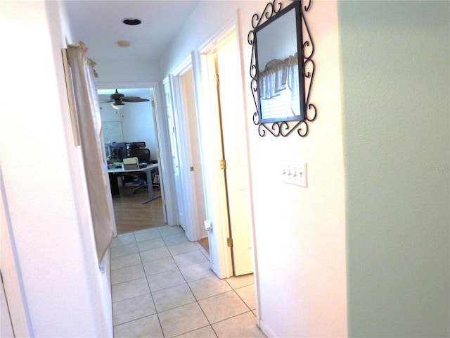 corridor with light hardwood / wood-style flooring