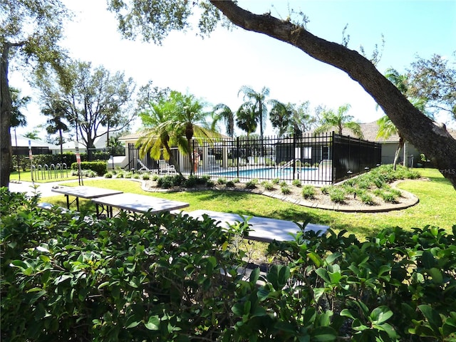 view of pool featuring a yard