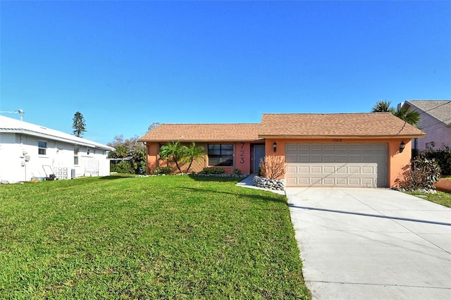 ranch-style house with a front yard and a garage