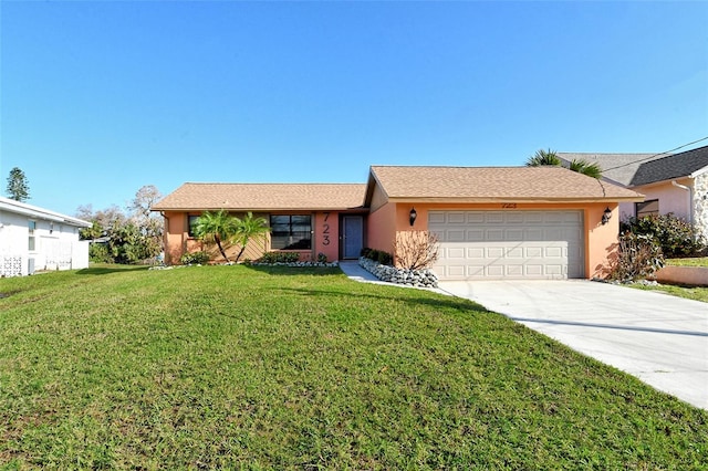 ranch-style home with a front yard and a garage