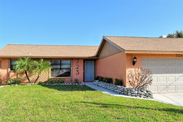 ranch-style home featuring a front lawn and a garage