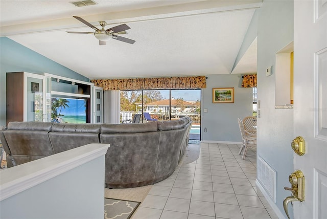 tiled living room featuring lofted ceiling and ceiling fan