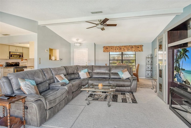 carpeted living room with a textured ceiling, lofted ceiling with beams, and ceiling fan