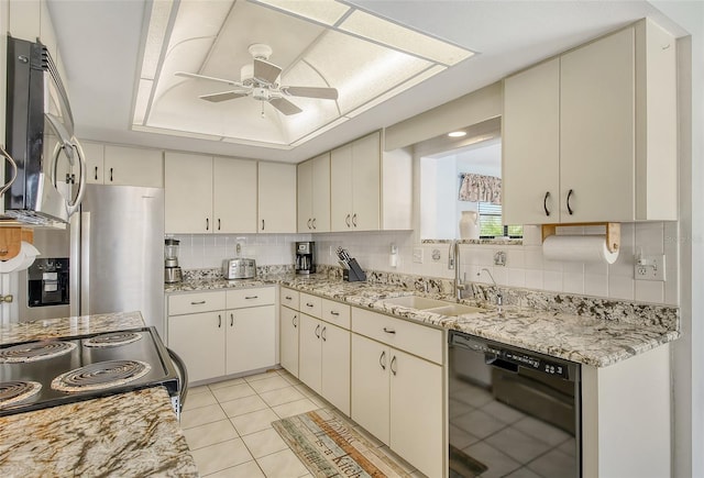 kitchen with tasteful backsplash, appliances with stainless steel finishes, sink, ceiling fan, and light tile patterned floors