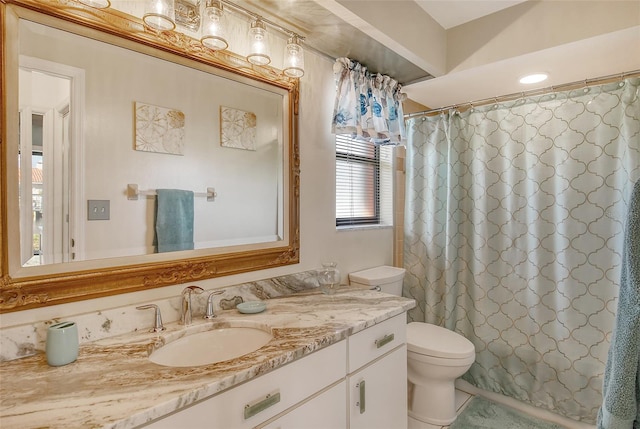 bathroom with vanity, toilet, tile patterned floors, and walk in shower