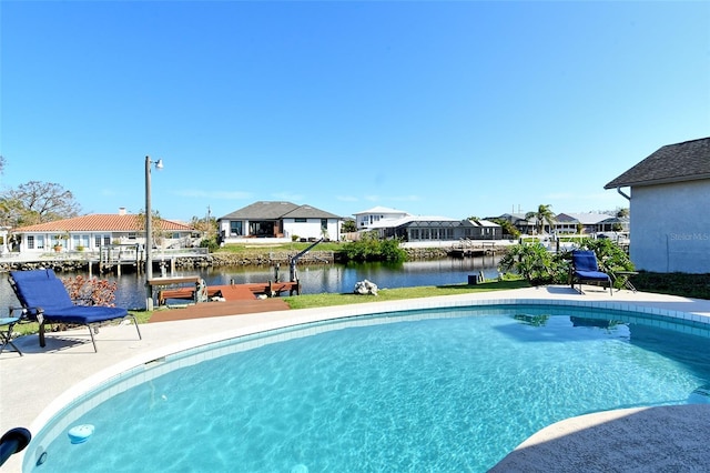 view of pool featuring a dock and a water view