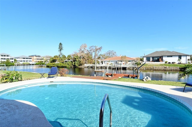 view of pool featuring a water view