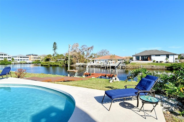 view of pool featuring a water view and a boat dock