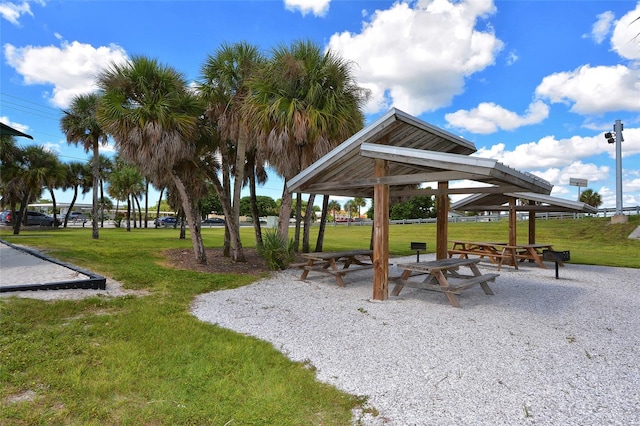 surrounding community with a gazebo and a yard