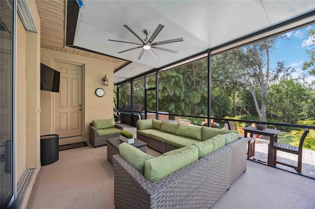 sunroom / solarium featuring ceiling fan