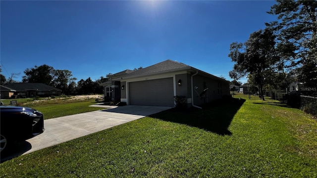 view of side of property featuring a lawn and a garage