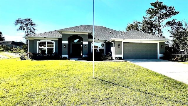 9832 SW 46th Ct, Ocala, FL 34476 - single story home with an attached garage, a shingled roof, a front lawn, stucco siding, and concrete driveway