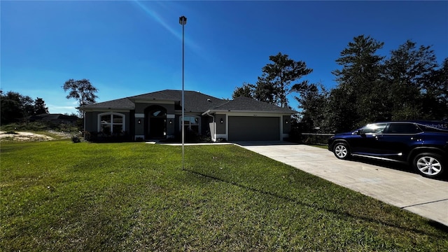 ranch-style home with a front yard and a garage