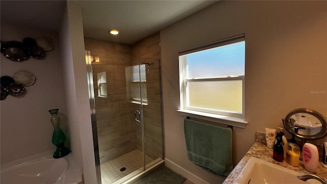 bathroom with vanity and a shower with shower door