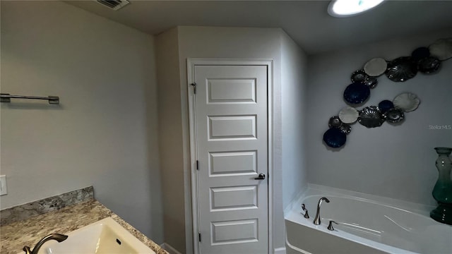 bathroom with sink and a bathing tub