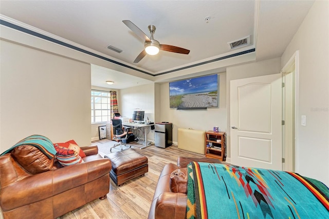 living room with light wood-type flooring and ceiling fan