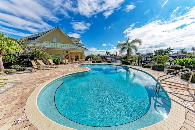 view of swimming pool with a patio area