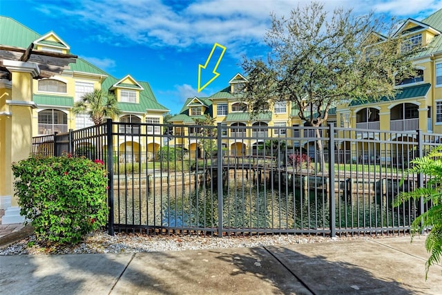 view of gate featuring a water view