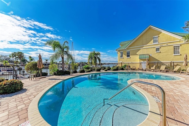 view of swimming pool featuring a patio area