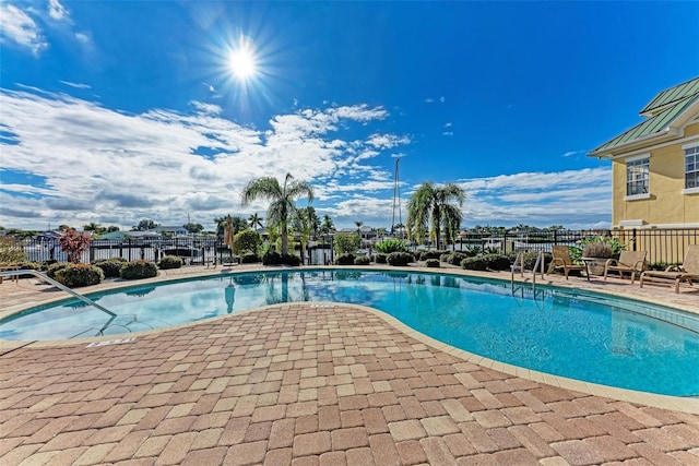 view of swimming pool with a patio area