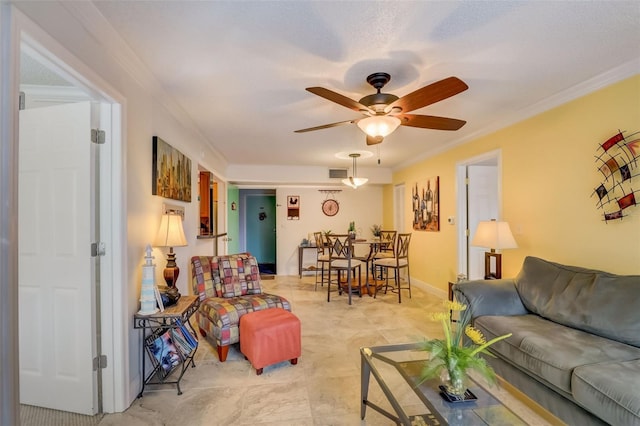 living room with ceiling fan and ornamental molding