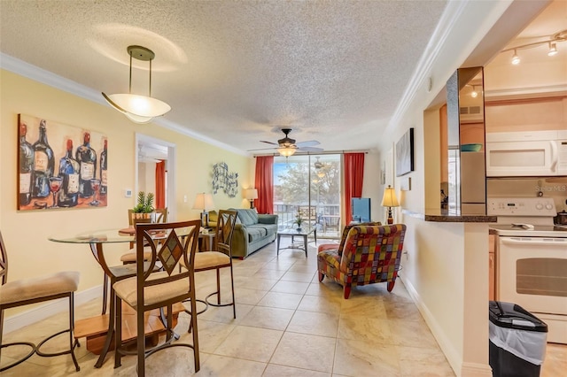 living room featuring a textured ceiling, ceiling fan, and crown molding