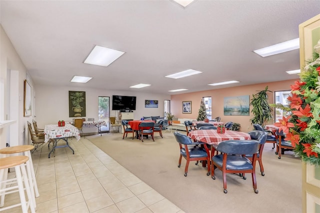 dining area with light colored carpet