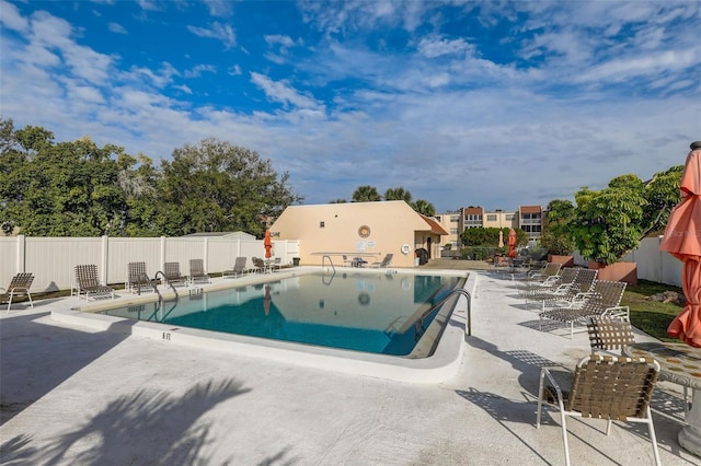 view of swimming pool with a patio