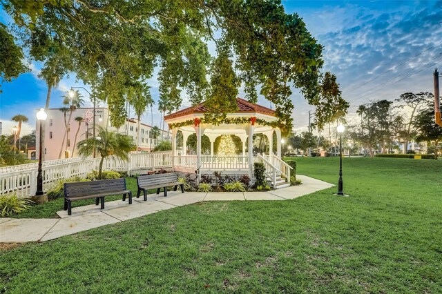 surrounding community featuring a gazebo and a lawn