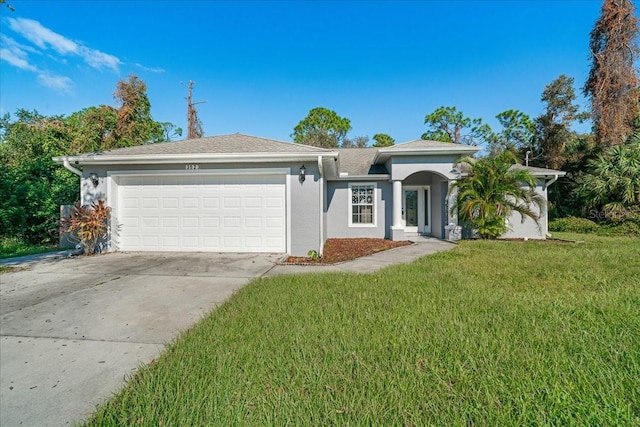 ranch-style home with a front yard and a garage