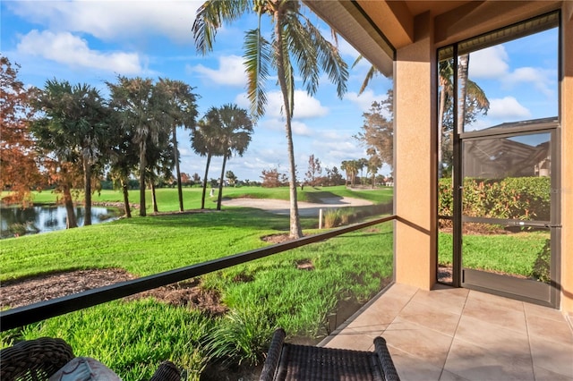 sunroom / solarium with a water view