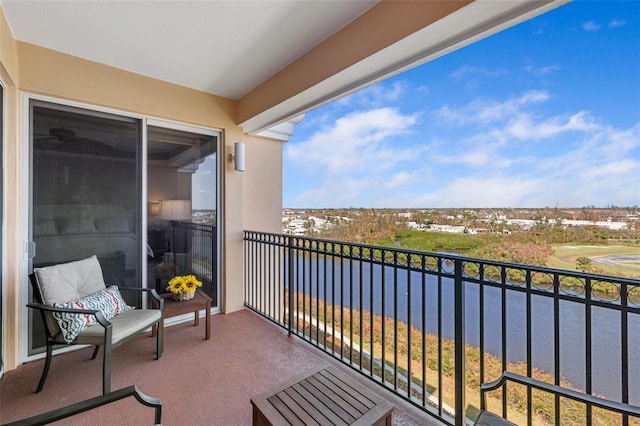 balcony featuring a water view