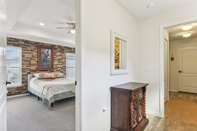 bedroom with light carpet and ceiling fan