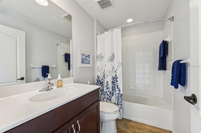 full bathroom featuring vanity, shower / bath combination with curtain, toilet, and wood-type flooring