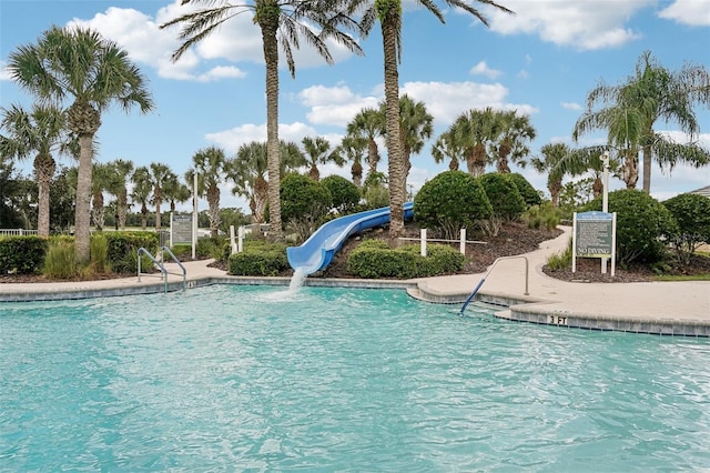 view of swimming pool featuring a water slide