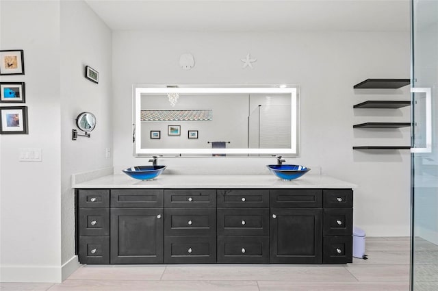 bathroom with vanity and walk in shower