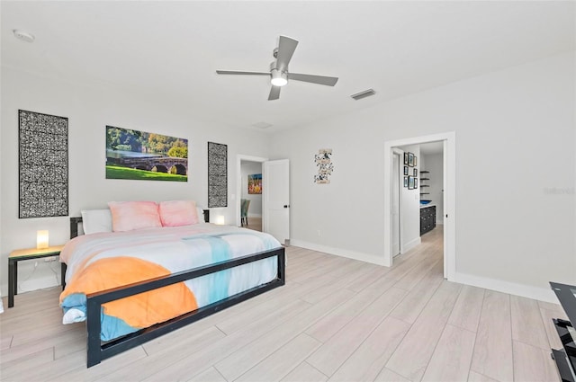 bedroom with ceiling fan and light hardwood / wood-style flooring