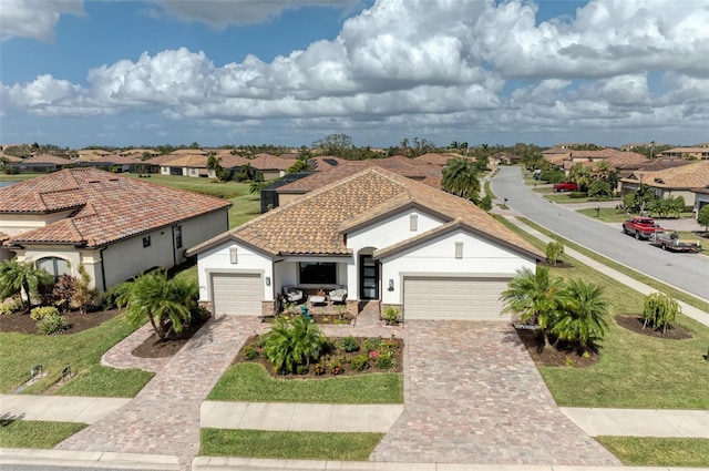 mediterranean / spanish-style house featuring a garage