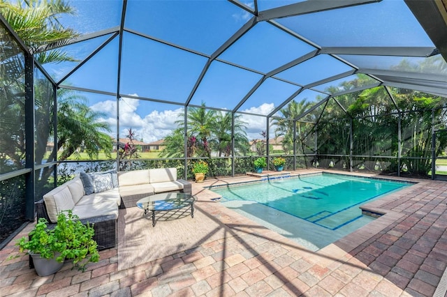 view of swimming pool with an outdoor hangout area, glass enclosure, and a patio