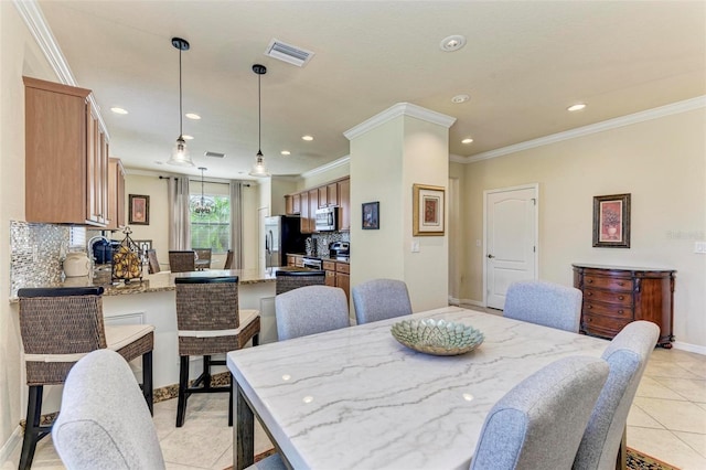 tiled dining space with ornamental molding