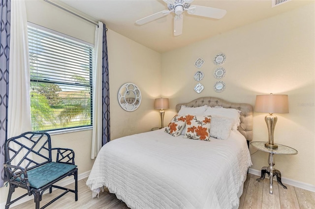 bedroom featuring ceiling fan and hardwood / wood-style floors